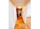 Hallway featuring wood floors with peach walls and neutral baseboards and door frames at 1318 Pine Terrace Ct, North Las Vegas, NV 89031
