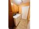 Laundry room with washer, dryer, and storage cabinets at 1318 Pine Terrace Ct, North Las Vegas, NV 89031