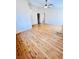 Spacious living room showcasing hardwood floors and ample natural light through multiple windows at 1318 Pine Terrace Ct, North Las Vegas, NV 89031