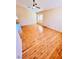 Spacious living room showcasing hardwood floors and ample natural light through multiple windows at 1318 Pine Terrace Ct, North Las Vegas, NV 89031