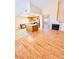 Open living space with hardwood floors connecting to the kitchen and cozy fireplace at 1318 Pine Terrace Ct, North Las Vegas, NV 89031