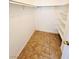 Walk-in closet with tiled floor and adjustable shelving for optimal storage at 1318 Pine Terrace Ct, North Las Vegas, NV 89031