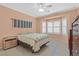 Cozy bedroom featuring a bay window, tile floors, and neutral colors for a relaxing space at 1735 Black Fox Canyon Rd, Henderson, NV 89052
