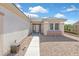 Inviting front entrance with a pathway and well-maintained desert landscape at 1735 Black Fox Canyon Rd, Henderson, NV 89052