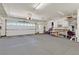 Spacious two car garage with extra storage space and workbench at 1735 Black Fox Canyon Rd, Henderson, NV 89052