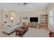 Inviting living room with tile floors and a comfortable seating arrangement at 1735 Black Fox Canyon Rd, Henderson, NV 89052