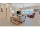 Comfortable living room with tile floors, plantation shutters and neutral decor at 1735 Black Fox Canyon Rd, Henderson, NV 89052