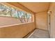 Balcony with view of mature trees and privacy wall at 2050 W Warm Springs Rd # 312, Henderson, NV 89014