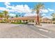Community entrance with palm trees, meticulous landscaping, and a private access point at 2050 W Warm Springs Rd # 312, Henderson, NV 89014