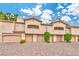 Exterior view of condos featuring garages and balconies at 2050 W Warm Springs Rd # 312, Henderson, NV 89014