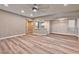 Open-concept living room with modern flooring, recessed lighting, and a pass-through to the kitchen at 2050 W Warm Springs Rd # 312, Henderson, NV 89014