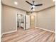 Bright main bedroom featuring wood-look floors and an ensuite bathroom at 2050 W Warm Springs Rd # 312, Henderson, NV 89014