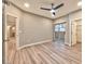Spacious main bedroom with a ceiling fan, modern flooring, and an ensuite bathroom at 2050 W Warm Springs Rd # 312, Henderson, NV 89014
