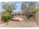 Beautiful backyard featuring a quaint stone patio and rock landscaping at 2056 Bay Thrush Way, North Las Vegas, NV 89084