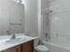 Bathroom featuring a tub-shower combo, toilet, and vanity at 2056 Bay Thrush Way, North Las Vegas, NV 89084