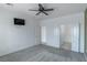 Neutral bedroom with ceiling fan, carpeted floors, and ample closet space at 2056 Bay Thrush Way, North Las Vegas, NV 89084