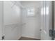 Walk-in closet provides ample storage with wire shelving and a window for light and ventilation at 2056 Bay Thrush Way, North Las Vegas, NV 89084