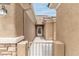 View of the gated front entrance with a path leading to the front door at 2056 Bay Thrush Way, North Las Vegas, NV 89084