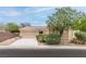 Charming single-story home featuring desert landscaping and a well-manicured yard at 2056 Bay Thrush Way, North Las Vegas, NV 89084