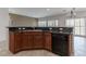 Kitchen area with stainless steel sink, black appliances, and dark countertops at 2056 Bay Thrush Way, North Las Vegas, NV 89084