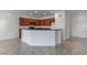 Bright kitchen with dark wood cabinetry, granite counters, and modern fixtures at 2056 Bay Thrush Way, North Las Vegas, NV 89084