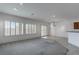 Open living area with plantation shutters and view to dining area and kitchen at 2056 Bay Thrush Way, North Las Vegas, NV 89084