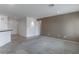 Living room with modern lighting, neutral paint, plush carpeting and kitchen bar at 2056 Bay Thrush Way, North Las Vegas, NV 89084