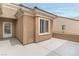 Exterior view of the patio with a doorway and window, providing a private outdoor space at 2056 Bay Thrush Way, North Las Vegas, NV 89084