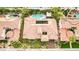 Expansive aerial view of a single-story home with private backyard pools in the neighborhood at 213 Villa Borghese St, Las Vegas, NV 89138