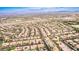 Expansive aerial perspective of a thriving community with diverse housing options and desert landscaping at 213 Villa Borghese St, Las Vegas, NV 89138