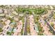 Neighborhood aerial view featuring homes with pools, solar panels, desert landscaping, and manicured common areas at 213 Villa Borghese St, Las Vegas, NV 89138