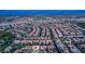 Extensive aerial view of a Primary-planned community featuring residential homes with desert landscaping at 213 Villa Borghese St, Las Vegas, NV 89138