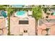 Birds-eye perspective of terracotta-roofed house featuring backyard pool and landscaped surroundings at 213 Villa Borghese St, Las Vegas, NV 89138