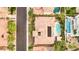 Terracotta-roofed house featuring backyard pool and surrounded by lush landscaping and neighborhood pools at 213 Villa Borghese St, Las Vegas, NV 89138