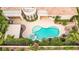 Aerial view highlights a sparkling backyard pool and spa, and covered patio area at 213 Villa Borghese St, Las Vegas, NV 89138