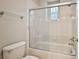 Clean bathroom with a shower-over-tub featuring glass doors and tile surround at 213 Villa Borghese St, Las Vegas, NV 89138