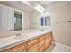 Spacious bathroom featuring double sinks with a large mirror and tile floors at 213 Villa Borghese St, Las Vegas, NV 89138