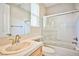 Well-lit bathroom with a shower-over-tub and vanity with tan-colored cabinetry at 213 Villa Borghese St, Las Vegas, NV 89138