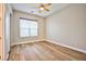 Sun-filled bedroom boasting wood-look flooring and modern ceiling fan at 213 Villa Borghese St, Las Vegas, NV 89138