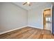 Serene bedroom with wood-look flooring and a door to the hallway at 213 Villa Borghese St, Las Vegas, NV 89138
