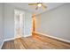 Bedroom showcasing wood-look flooring and access to a bathroom and hallway at 213 Villa Borghese St, Las Vegas, NV 89138