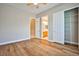 Bright bedroom with wood floors, ceiling fan, closet and bathroom access at 213 Villa Borghese St, Las Vegas, NV 89138