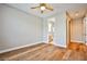 Bedroom boasting wood-look flooring and doors to a bathroom and closet at 213 Villa Borghese St, Las Vegas, NV 89138