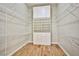 Walk-in closet with built-in shelving and wood floors at 213 Villa Borghese St, Las Vegas, NV 89138