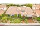 Inviting single-story home with lush landscaping, a terracotta roof, and a gated entrance at 213 Villa Borghese St, Las Vegas, NV 89138