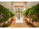 Inviting front entry with lush greenery framing the walkway to the front door at 213 Villa Borghese St, Las Vegas, NV 89138