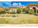 Attractive single-story home featuring a lush green lawn and mature landscaping at 213 Villa Borghese St, Las Vegas, NV 89138