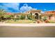 Beautiful single-story home with a well-manicured lawn and desert landscaping at 213 Villa Borghese St, Las Vegas, NV 89138