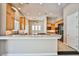 Well-equipped kitchen with modern appliances, breakfast bar and tile backsplash at 213 Villa Borghese St, Las Vegas, NV 89138