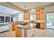 Modern kitchen with granite countertops, stainless steel appliances, and wooden cabinets at 213 Villa Borghese St, Las Vegas, NV 89138